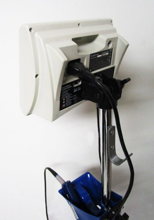 A machine with a blue bucket attached to it.