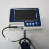 A medical device with a monitor attached to it.