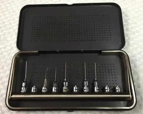 A set of dental tools in a black case.