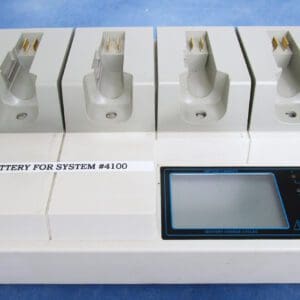 A white device with four batteries on it.