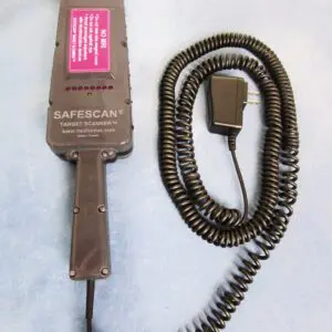 A brown hair dryer and cord on top of a white surface.