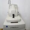 A white machine with some black handles on it