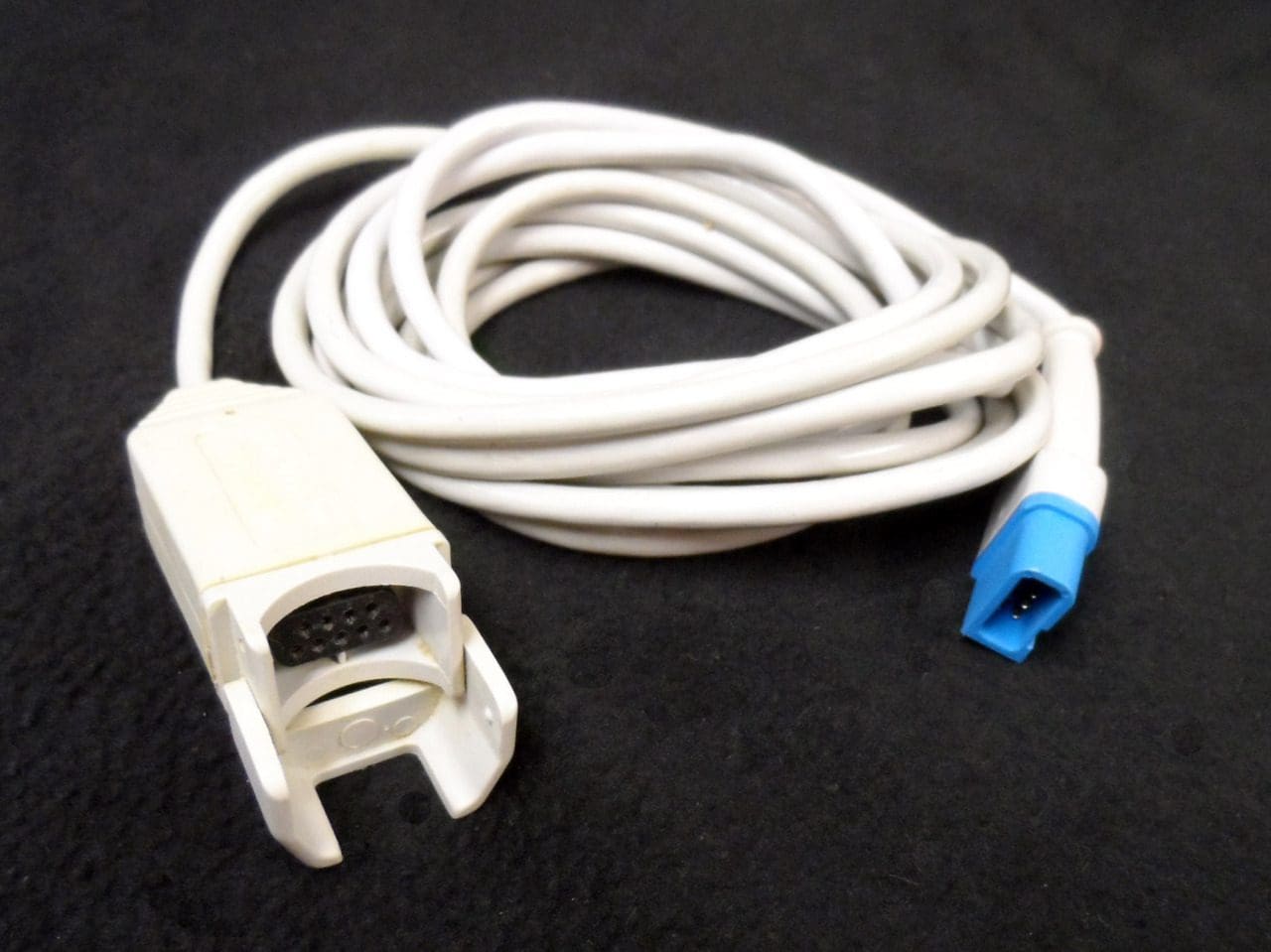 A white cable with a blue connector attached to it.