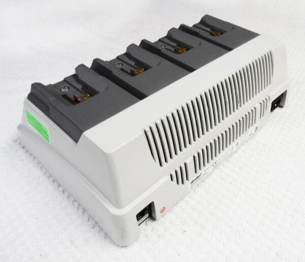 A battery charger with four different types of batteries.