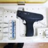 A gun is in the box and there are many other things.