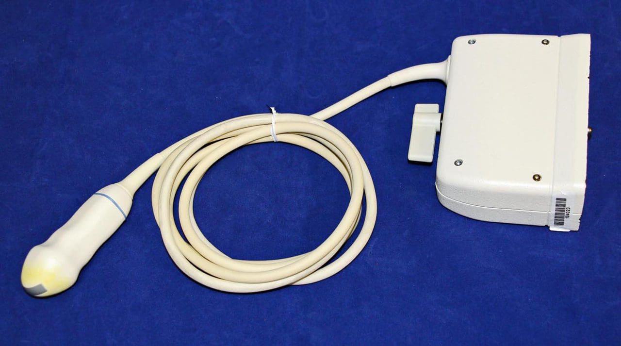 A white device with a cord attached to it.