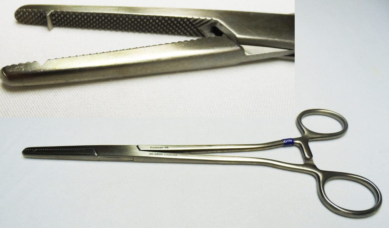 A pair of surgical scissors and a pair of scissors.