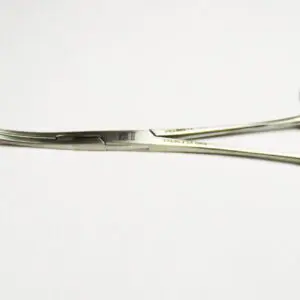 A pair of surgical scissors on a white surface.