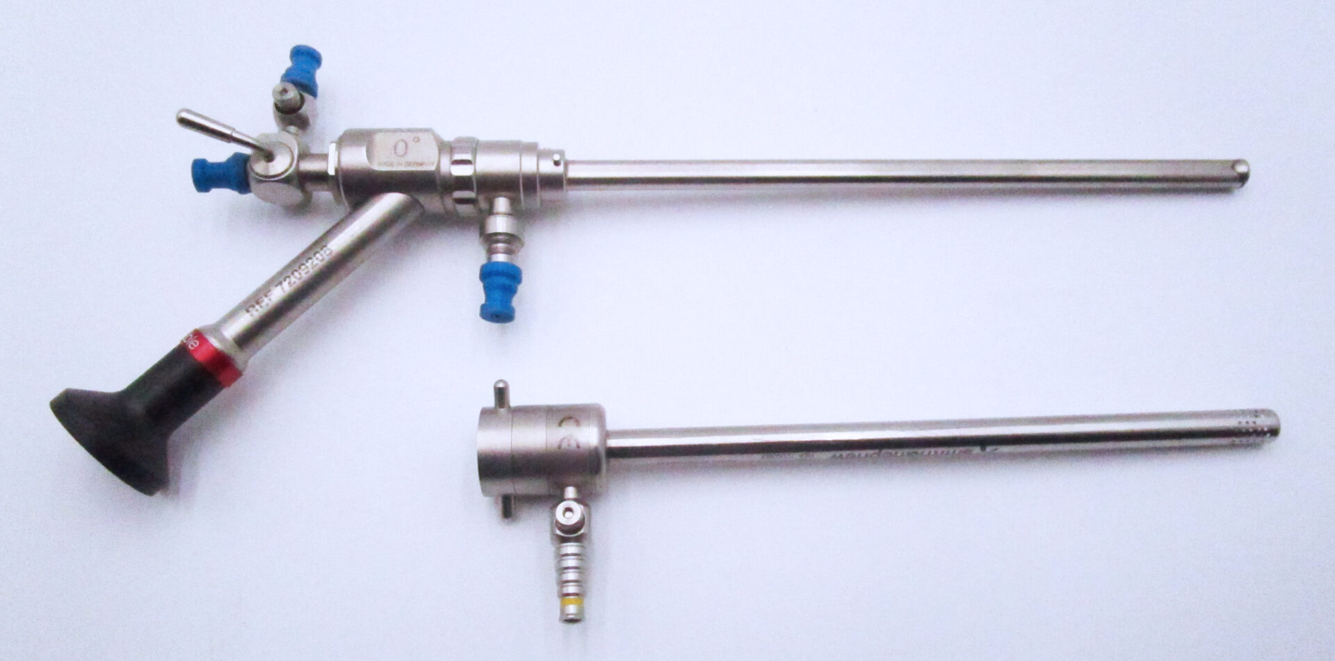 Two stainless steel pipes with a blue handle.