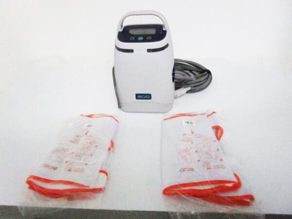 White medical compression pump with sleeves.