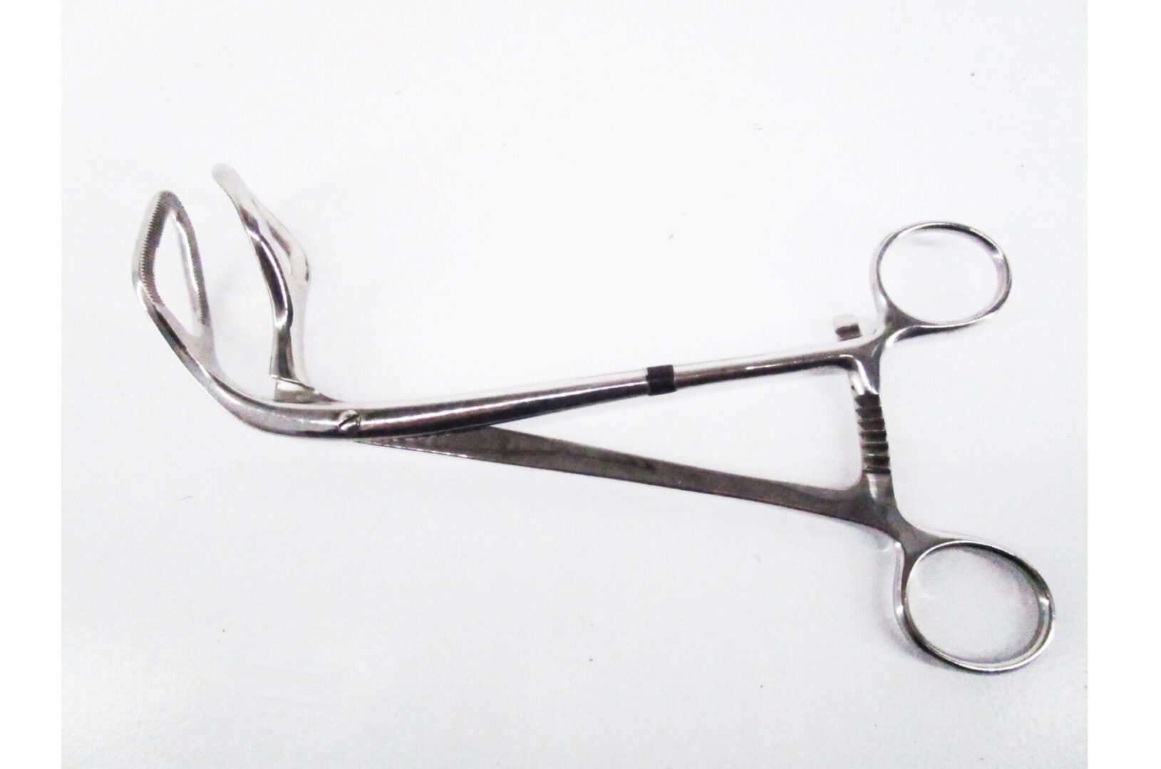 Stainless steel surgical clamp tool.