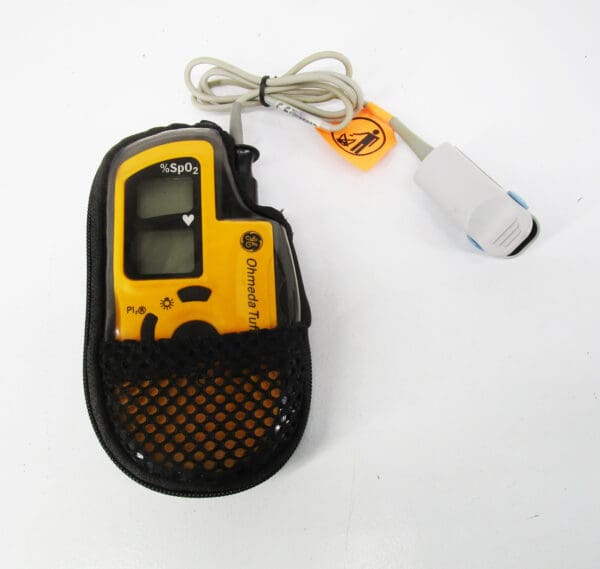 Yellow pulse oximeter with finger probe.