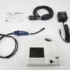 A white device with cords and wires on it.