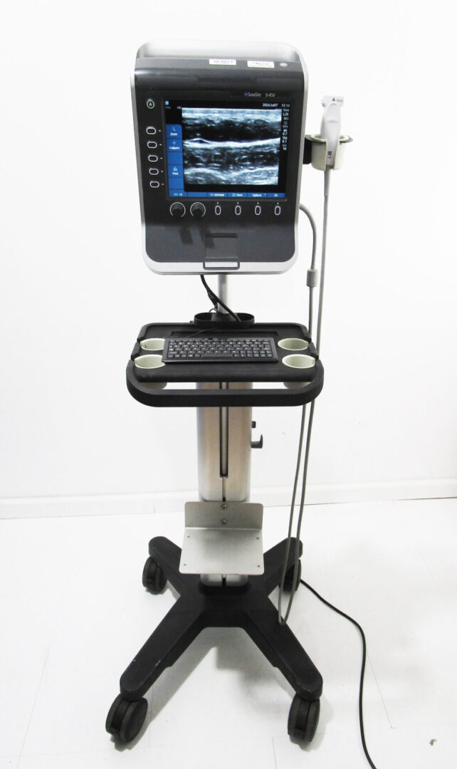 Portable ultrasound machine with a monitor.