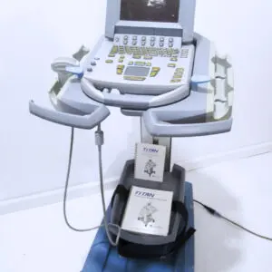 Ultrasound machine with manuals on a cart.