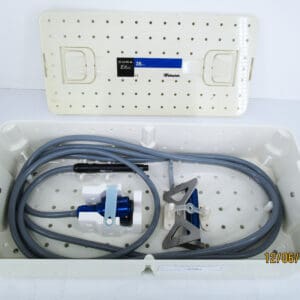 Medical device in open perforated storage case.