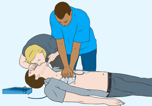 CPR in progress with two people.